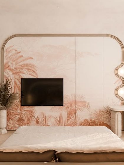 The opposite wall of the bedroom features a custom media unit with a soft, curved frame and a delicate, hand-painted mural. A small vanity desk is seamlessly integrated into the design.