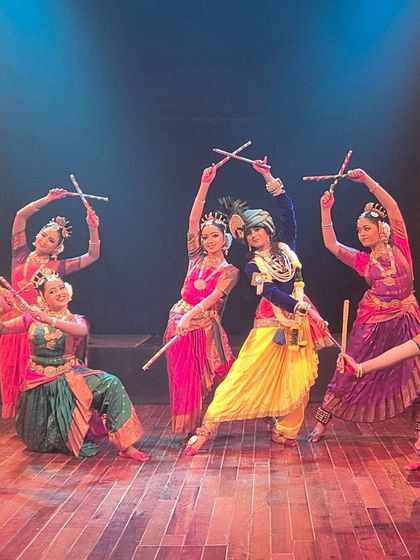 Our dancers performing a lively dandiya raas sequence in the "KRISHNA" production. This energetic group choreography showcases the celebratory and joyful aspects of Krishna's story.