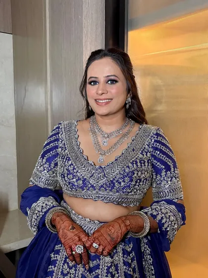 A full-smile shot of this gorgeous reception look, showing how the makeup lights up her face.