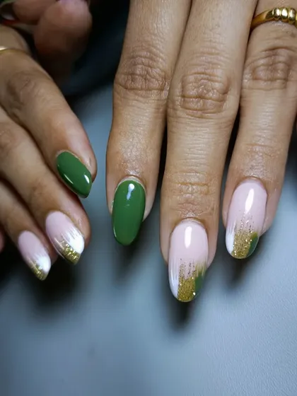 Another view of the stylish olive green and gold brushstroke manicure.
