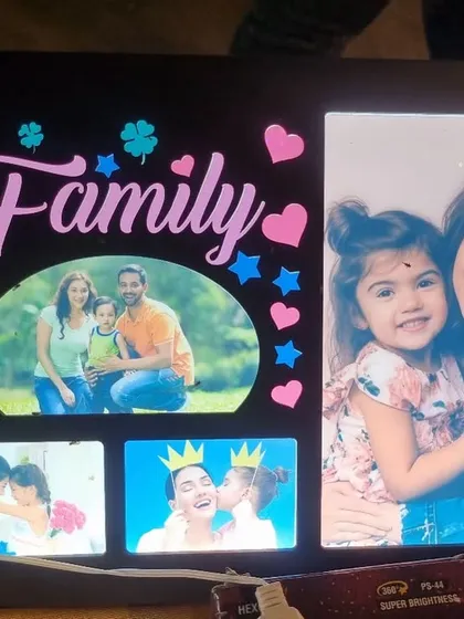 Celebrate your bond with a "Family" themed LED collage frame. It has space for multiple photos and features colorful, illuminated text and graphics.