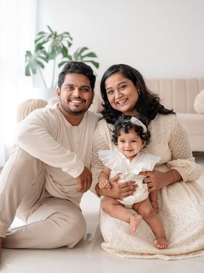 A classic family portrait with everyone smiling.