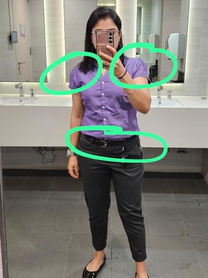 During a fitting, we analyze every detail. Here, I've circled areas to show how a different sleeve cut and a proper tuck can completely change the silhouette.