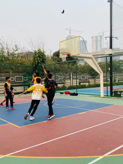 A player elevates for a layup, showing great athleticism.