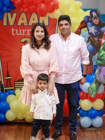 A happy family celebrates their son's third birthday with our superhero theme. We love seeing families come back to celebrate with us year after year.