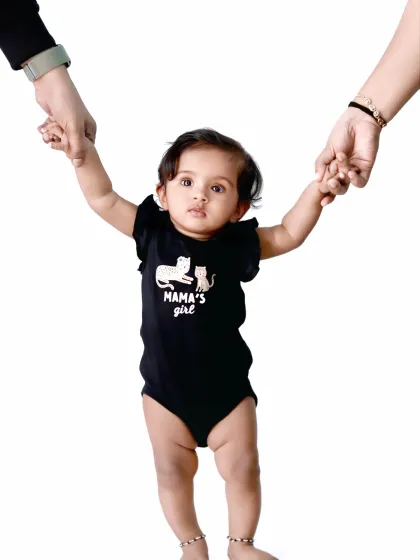 This little one is truly "Mama's Girl." I love using cute outfits and clean, simple backgrounds to keep the focus on your baby's adorable personality.