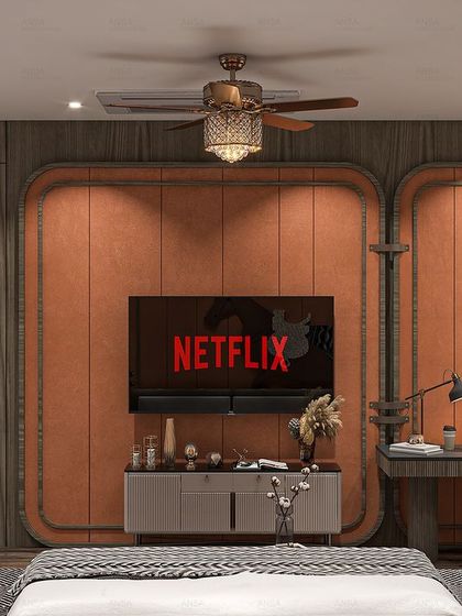 This bedroom includes a functional and stylish workspace. The warm terracotta panels on the wall cleverly integrate a desk and TV unit, making it a multi-purpose room without sacrificing style.