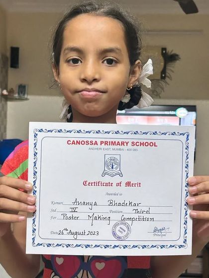 Ananya Bhadekar, a 4th-grade student, won the third prize in her school's poster making competition. Her certificate of merit is a proud accomplishment.
