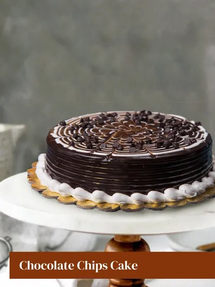 This Chocolate Chips Cake is all about texture and taste. A decadent chocolate cake is generously topped with chocolate chips and finished with a beautiful ganache pattern, offering a delightful crunch in every bite.