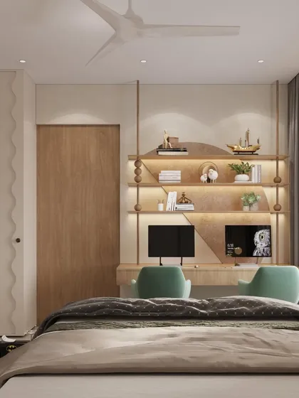 Across from the bed, we designed a custom twin-desk study zone with golden-lit shelves. The space is crafted to grow with the child, merging function and flair with details like wavy wardrobe doors.