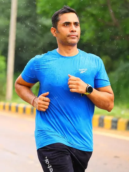 A runner focused and drenched in sweat, showing the effort that goes into our Sunday long runs.