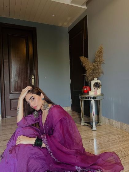 A thoughtful moment captured in this beautiful ethnic outfit. The rich color and flowing fabric make it a joy to wear.