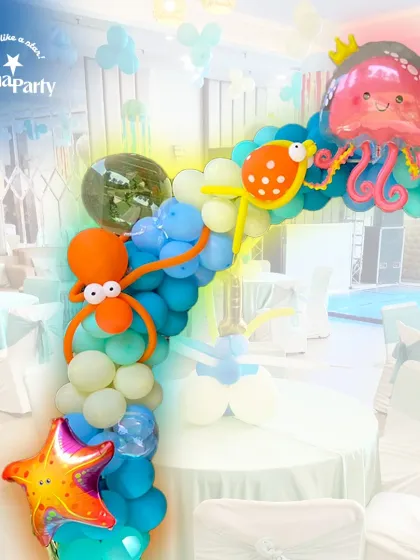 An ocean of fun. This underwater-themed balloon arch is perfect for a kid's party, featuring cute octopus and jellyfish balloon sculptures, starfish, and a variety of blue and white balloons to create a bubbly sea effect.