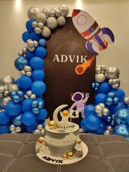 Our space theme decor provides the perfect setting for the birthday cake. The backdrop, balloons, and even the cake itself are all coordinated to create a cohesive and stellar celebration.