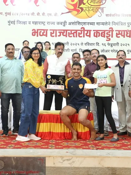 Ajinkya receiving his 'Best Raider' award on stage.