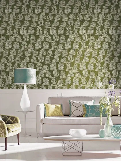 The Galerie Interior Design Collection brings a sense of calm and balance to this living room. The repeating leaf pattern on the wallcovering creates a Zen-like sensibility, grounded by refined textures and subtle green tones.