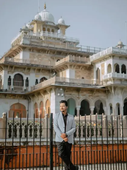 A stylish solo portrait of the groom, using the grand architecture of Albert Hall and its iron fence as a backdrop. It’s a strong, confident shot.