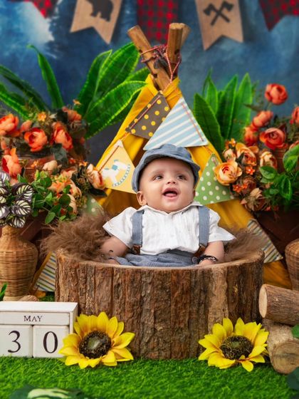 Another joyful shot from the camping theme. The teepee and woodland props create a playful and imaginative setting for milestone photos.
