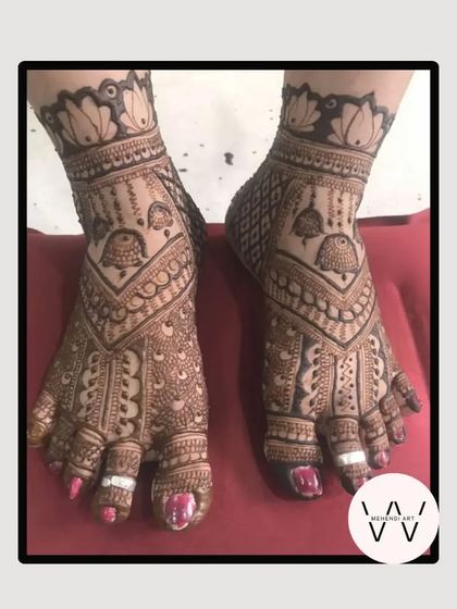 A detailed feet design featuring jhumka (earring) motifs, perfect for any festival.