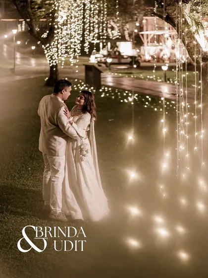 A fairytale moment under a canopy of lights. I specialize in transforming outdoor spaces into magical settings, like this boho-themed sangeet in Goa, where the couple is enveloped in a warm, dreamy glow.