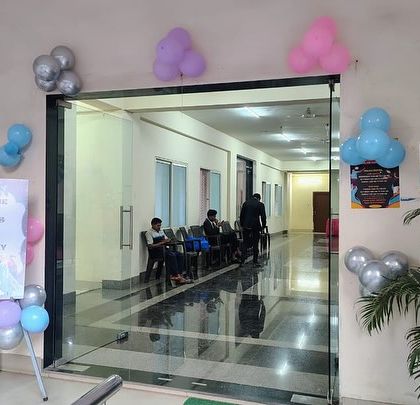 The entrance to Tisya's 'Frozen' themed 1st birthday party, welcoming guests with a custom sign and balloon clusters in the party's color scheme.