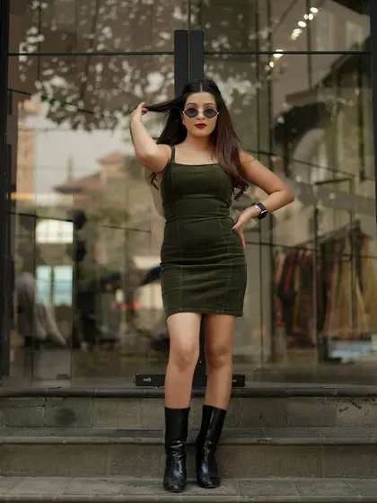 A playful pose that adds personality to the street style set.