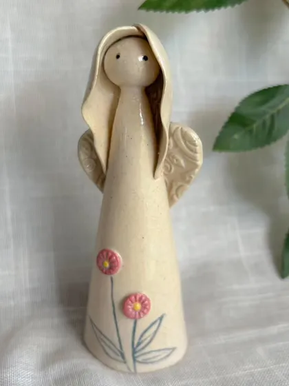 This angel figurine, with its simple form and hand-painted flowers, is part of my Yuletide Collection. It's a sweet and subtle piece of holiday decor.