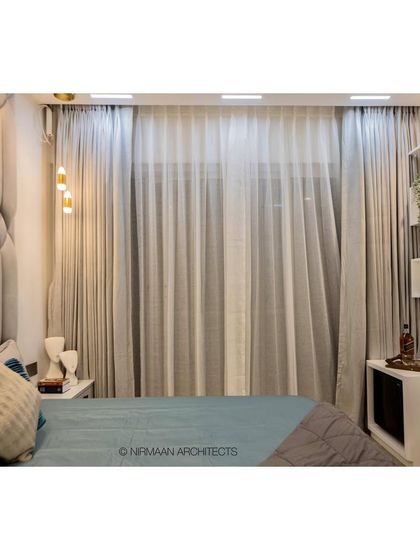 Another view of the smart master bedroom at Bhagwati Greens. The automated curtains and lighting can be controlled from the bedside, offering ultimate convenience and comfort.