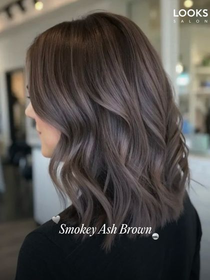 This is our Smokey Ash Brown, a modern and cool-toned option. It's perfect for neutralizing brassy tones and achieving a sophisticated, matte-like finish. We cut the hair into a stylish lob to complete this chic, contemporary look.