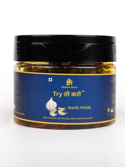 A small jar of Garlic Pickle on a white background.