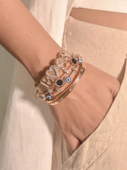 Another angle of the 'BOSS' stack. I love how the different textures and charms come together to create a look that's both personal and fierce.