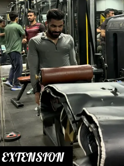 Day 27: Isolating the quadriceps with the leg extension machine for a complete leg workout.