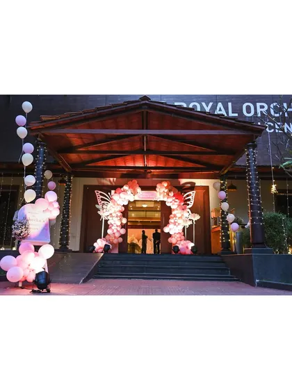 The grand entrance to a butterfly-themed event. A stunning balloon arch with large butterfly wing cutouts creates an impressive welcome for guests.