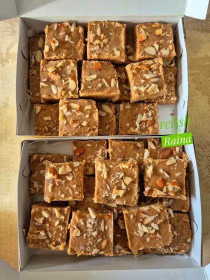 Two boxes of Gur Padi, a sweet that is crispy yet melts in your mouth. I can customize it by not adding almonds if clients prefer it for their kids.