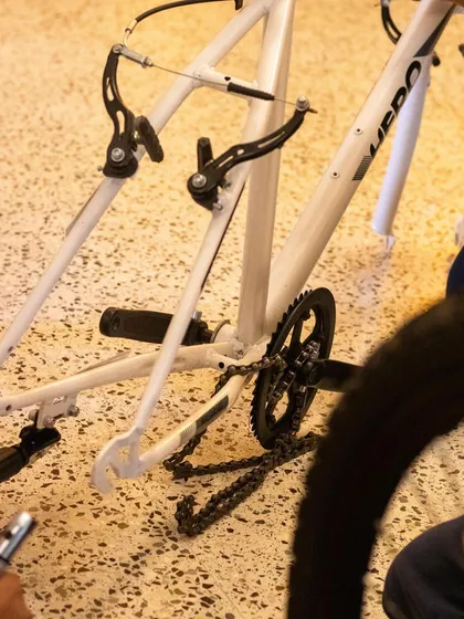 Here you can see the bicycle frame stripped down, with the chain and brake assembly exposed. This is what it looks like when we break things down to their fundamental parts to understand them.