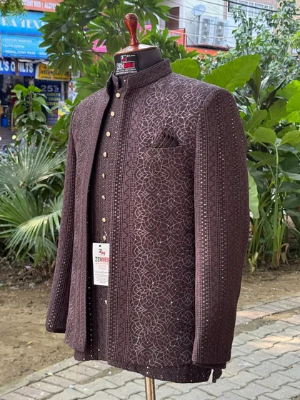 Here is my modern take on a classic Jodhpuri suit. The rich brown fabric and intricate geometric patterns create a look that is both minimal and bold, perfect for any wedding event.