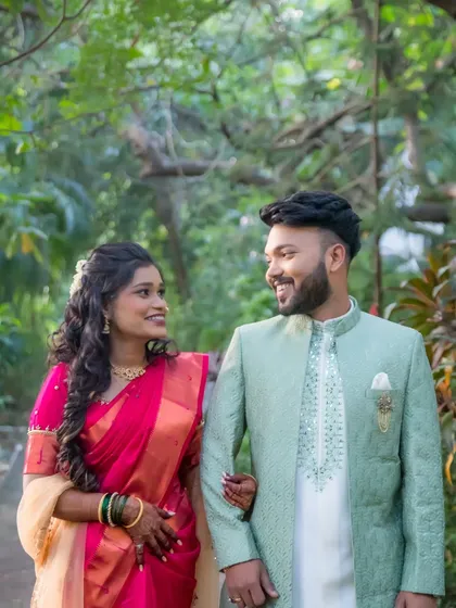 The couple takes a romantic stroll during their engagement photoshoot. These walking shots create a sense of movement and natural interaction.