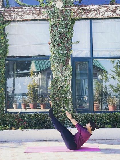 Finding the art of balancing in Naukasana, or Boat Pose. This asana is incredible for strengthening the core and hip flexors.