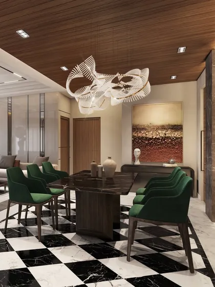 A view of the dining area showing its connection to the living space. The wooden ceiling helps define the dining zone, creating a warm and intimate atmosphere that contrasts beautifully with the polished marble floor.