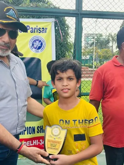 Garvit Gupta receiving his second-place award for the Under-8 category at the DDA Tennis Tournament. Every tournament is a valuable learning experience.