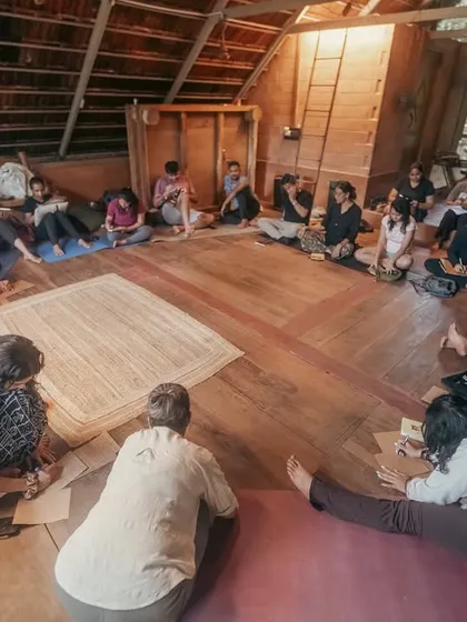 Here, a group gathers in a sharing circle, a sacred space for honest connection and heartfelt conversation. These circles are central to my retreats, offering a judgment-free zone to be seen, heard, and supported by the community.