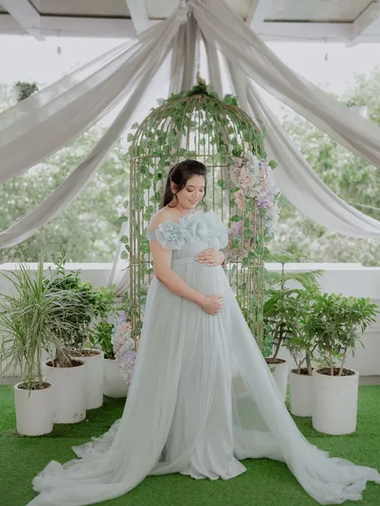 A quiet, reflective pose in our light blue Isabella gown. The off-shoulder design and front slit offer beautiful and varied posing opportunities.