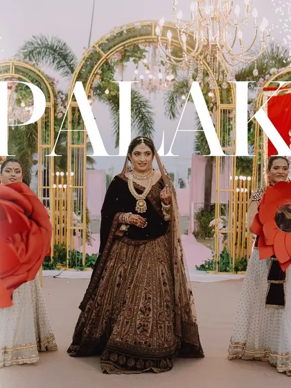 A grand bridal entry, with bridesmaids holding giant paper flowers. A creative and visually stunning moment.