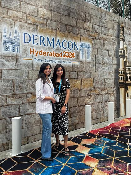 Discussing the latest trends in 'Skinception to Skinnovation' with a fellow dermatologist at Dermacon Hyderabad 2024.