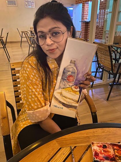Another photo of me with my cheesecake sketch. I love urban sketching and capturing the cafe culture of Bangalore in my favorite sketchbook.