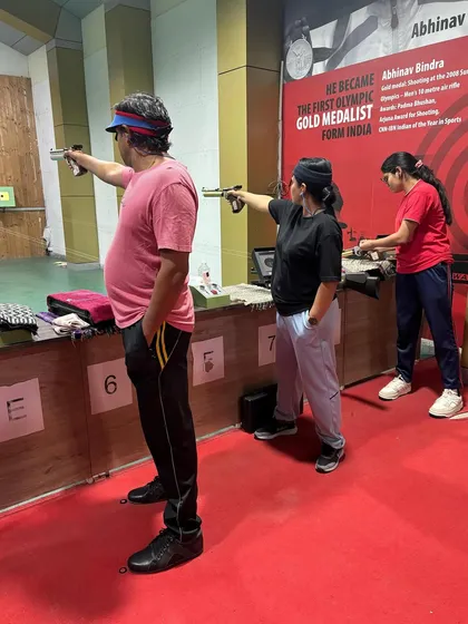 Our pistol shooters practicing their aim at the range. We offer coaching across multiple Olympic disciplines, including 10m Air Pistol.