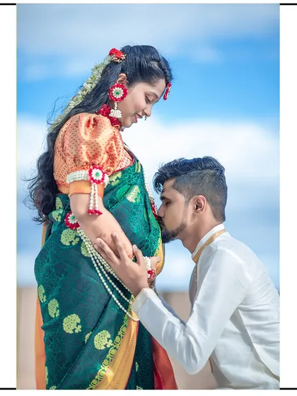 A reverent kiss on the baby bump, showing the dad-to-be's love and connection with his unborn child.