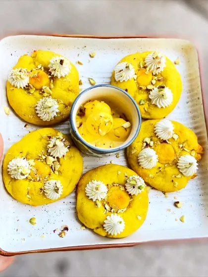 Our Rasmalai Cookies are a unique fusion treat. We combine the texture of a soft cookie with the classic flavors of rasmalai, including saffron and pistachio, for a truly special bite.