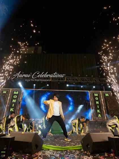 A powerful solo performance by a family member, amplified by dramatic spotlights and cold pyrotechnics. I use stage effects to turn family dances into show-stopping productions.