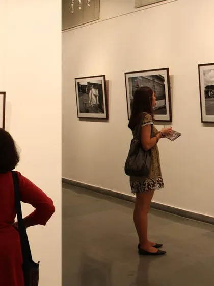 Visitors at my debut solo show, 'Face two Face' (2012). This exhibition was a major milestone, exploring identity through black and white street photography and staged portraits.